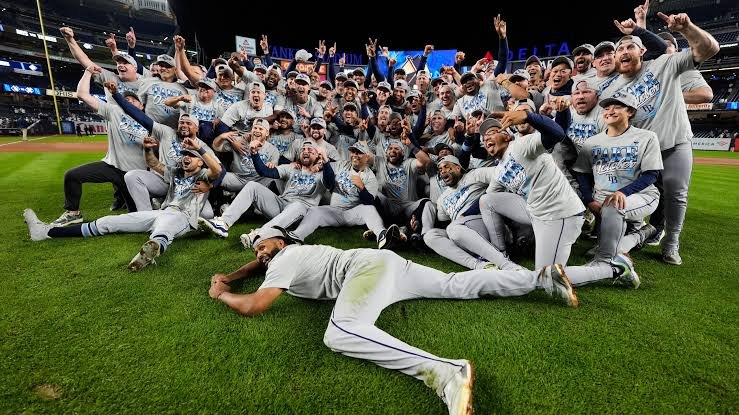 Rays players celebrate on the field at Yankee Stadium after sweeping the Yankees in the ALDS